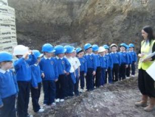 Children view the progress to their new school