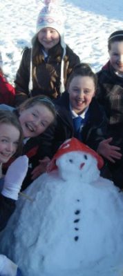 Pupils making snowman