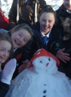 Pupils making snowman